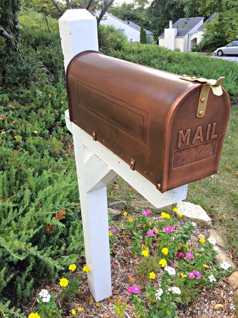 Giving our mailbox a makeover was on my to-do list for far too long, but earlier this summer, I finally checked it off. After our exterior was painted, I broke out the paint brush and the leftover paint from the trim. The project included: Painting the existing post white Replacing the actual mailbox with a ... Read More about Before and After: Mailbox Makeover Copper Mailbox, Mailbox Garden, Mailbox Makeover, Mailbox Landscaping, Painted Mailboxes, Shelf Arrangement, Diy Mailbox, Mailbox Ideas, Floating Shelves Kitchen