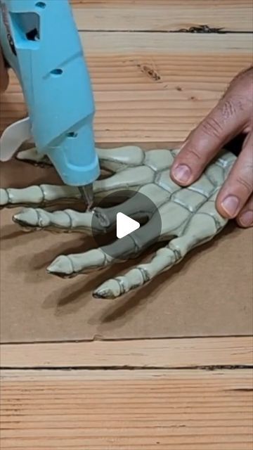 Hometalk on Instagram: "Grab 5 Dollar Tree skeleton hands...💀🧙‍♀️🎃👻" Skeleton Hand Halloween Decor, Painting Skeleton Hand, Diy Scary Halloween Hands, Dollar Halloween Diy, Scary Halloween Wall Decor, Tree Stump Halloween Ideas, Diy Skeleton Head Decor, How To Age Plastic Skeleton, Dollar Tree Diy Halloween Outdoor Decor