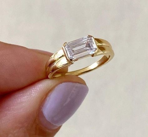 East To West Emerald Cut Moissanite Engagement Ring, Solitaire Half Bezel Double Row Band Ring, Daily Wear Ring, Gift For Her, 14K Gold Ring Item Description: Stone - Moissanite & Simulated Diamond Shape-  Emerald Cut  1. White Gold: 10K/14K/18K 2. Yellow Gold: 10K/14K/18K 3. Rose Gold: 10K/14K/18K 4. Silver: Sterling Silver 925 Size Customization: What Size you want... * You can also Customize ring size in US 4 to US 12! It sometimes affects to price. * Main Stone & Shape Customization: Main Stone: Cubic Zirconia, Moissanite, Natural Diamond, CVD Diamond Shape Choice: Round Cut, Heart, Princess Cut, Pear Cut, Cushion Cut, Marquise, Oval Shape, Asscher, Emerald, Radiant, Old European Cut, Old Mine Cut * Check out Special Notes: At checkout, leave us a note in the message box for the Ring s Horizontal Ring Engagement, Signet Engagement Rings Women, Sideways Emerald Engagement Ring, East West Emerald Engagement Ring, East West Marquise Ring, East West Engagement Ring, Ring Daily Wear, Engagement Rings Unique, Emerald Cut Moissanite Engagement Ring