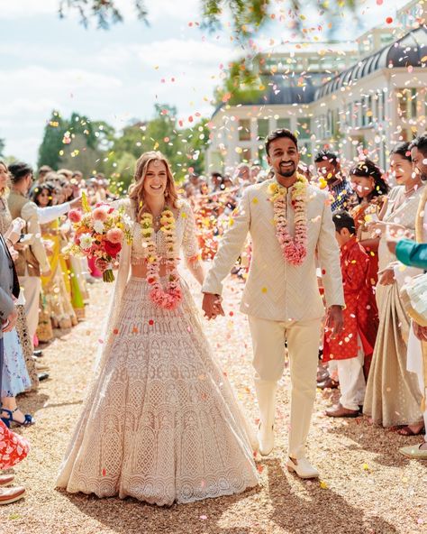 A fusion of LOVE and colour for Tasha & Aaron’s big day in Hampshire, England! 💖✨🌸 This vibrant Indian + English celebration was bursting with bold, bright florals and notes of tradition. The floral arch was inspired by a traditional Mandap - bursting with stunning hanging florals in bright orange and pink, creating the perfect backdrop for an outdoor ceremony in the beautifully landscaped gardens. Other 'WOW' moments include the garland-draped staircase and all-PINK decor in the dining ... Indian English Wedding, Traditional Mandap, Hanging Florals, Indian English, Luxury Florists, Hampshire England, English Wedding, Bright Florals, Wedding Flower Inspiration