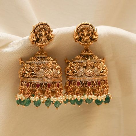 Show off India's culture and tradition by wearing perfectly handcrafted temple jewellery jhumkas! Explore our temple jewellery collection! Latest Design Earrings Gold, Gold Wedding Earrings Indian, Lakshmi Jhumkas Gold, Lakshmi Buttalu Earrings Gold, Temple Jewellery Earrings Antique, Cz Earrings Indian Gold, Jumki Design Gold Latest, Temple Earrings Gold Jewelry, Antique Gold Jhumka