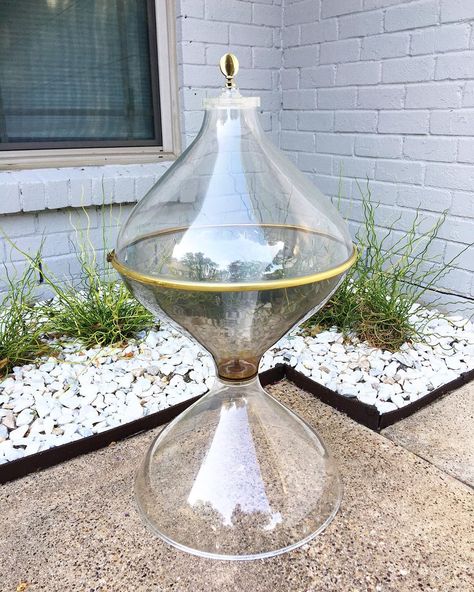 Modern Atomic 1960s space age teardrop acrylic terrarium with tulip base and brass band. Rare and groovy. Some light scratches to acrylic.… Mcm Terrarium, Space Age Terrarium, 1960s Space Age, Alien Specimen Jars, Atomic Space Age, Swung Vases, The Vault Of The Atomic Space Age, Swung Glass Vase, Brass Band