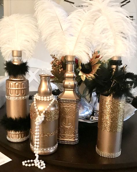 Roaring 20s Bottle Makeover Gatsby Centerpiece Ideas Roaring 20s, Roaring 20s Table Decorations, Gatsby Party Table Decorations, Roaring 20s Gala Decor, Roaring 20s Decor, 20s Centerpieces Diy, Roaring 20s Party Decorations Diy, Great Gaspy Party Decor, Gatsby Party Decorations Diy