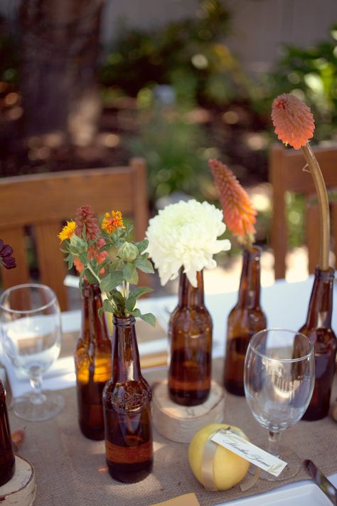 Beer-Bottle-Centerpiece-1 Beer Bottle Wedding Decor, Beer Bottle Centerpieces, Beer Bottle Wedding, Beer Bottle Vase, Uni Graduation, Beer Bottle Decor, Party Boards, Beer Bottle Candles, Autumn Elements