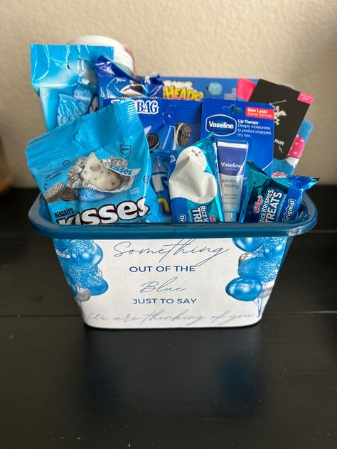 Grief treat gift basket filled with rice krispie treats, socks, lip balm, extra gum, oreos, herskey cookies and cream kisses, and sour heads. Blue Valentines Basket, Something Out Of The Blue Bc I Love You, Blue Burr Basket, Surgery Gift Basket Recovery For Men, Blue Gift Basket Ideas For Him, Blue Things For Gift Basket, Something Out Of The Blue For Boyfriend, When Your Feeling Blue Basket, Something Out Of The Blue Because I Love You Basket