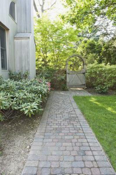 Over time your brick paver patio, walkway, driveway or path will become worn, faded or stained due to exposure to the elements. Rejuvenate these old pavers with a coat of acrylic concrete or paving paint. Designed especially for cement or stone surfaces that experience traffic, the paint comes in a wide variety of ... Landscape Bricks, Shed Landscaping, Brick Paver Patio, Backyard Walkway, Side Yard Landscaping, Brick Walkway, Concrete Walkway, Side Yards, Brick Pavers