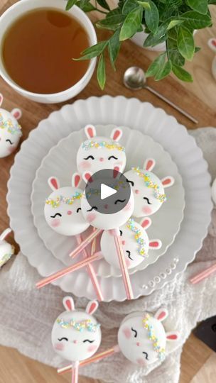 34K views · 2.2K reactions | 🐰Bunny Macaron Pops🐰

I made bunny macaron pops last year and wanted to make them again this year because you can’t have Easter without the Easter bunny. 🐇

These macaron pops were filled with banana milk buttercream and marshmallow fluff. They were then dipped in @foliay_llc deco melts in white. The bunny ear sprinkles and nonpareils are then added while the melts are still wet. The eyes and nose are drawn in with black and pink candy melts. And lastly, I use @bakell rose gold luster dust as blush for the bunny cheeks. 😊

Products used:
- @foliay_llc piping bags; deco melts in white and pink; spring nonpareils; save 15% with promo JOYCE15
- @wiltoncakes gel colors in white and violet; piping tip 10; bunny ear sprinkles; black candy melts
- @bakell rose gol Macaron Pops, Cake Gel, Gold Luster Dust, Piping Tip, Easter Appetizers, Gel Colors, Black Candy, Luster Dust, Banana Milk