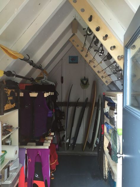 Water Ski Storage Rack, Lake Towel Storage, Beach House Storage Shed, Fishing Shed Ideas, Lake House Storage Room, Lake House Fishing Decor, Lake Shed Storage Ideas, Life Vest Storage, Boat Shed Storage