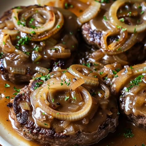 Hamburger Steak with Onions and Gravy Recipe - Hamburger Stake, Hamburger Steak With Onions, Steak With Onions, French Onion Meatloaf, Hamburger Steak Recipes, Meatloaf Mix, Hamburger Steaks, Traditional Meatloaf, Steak And Onions