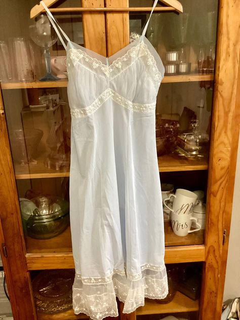 Gorgeous 1950's style nylon slip. Vintage Pale blue nylon slip. The back is square cut with non adjustable straps Very sweet and feminine. In excellent condition.  ERA 1950s FABRIC Nylon Label Reads: Bry-Nylon                          Chic Salon 34 Condition Excellent   No marks, no stains, no tears.   I post worldwide except for Germany. Thank you for your understanding.                                           Measurements: Bust 86cm/34inches  Waist 73cm/28.5 inches Length from underarm 82cm/ Monochrome Wardrobe, Vintage Blue Dress, 1950s Fabric, 1950s Woman, 60s 70s Fashion, Lingerie Vintage, Womens Lingerie, Vintage Slip, 50s Style