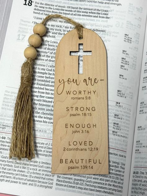 "Our wood bookmarks are made of high quality 1/16\" wood that is the perfect thickness for any book!  DETAILS: * All bookmarks are laser cut and engraved * Size: Approximately: 6\" tall, 2.15\" wide, 1/16\" thick All bookmarks are shipped USPS ground advantage, unless an upgrade is requested. We mail all bookmarks in mailing boxes (not bubble mailers) so shipping price reflects mailing with boxes. We can fit several bookmarks or a variety of bookmarks/ornaments/car charms in one box, so please feel free to reach out if you'd like to combine shipping and mail together!" Laser Engraved Bookmarks, Christian Craft Ideas, Bookmark Bible Verse, Laser Creations, Christian Bookmarks, Christian Gift Shop, Bible Bookmarks, Wood Bookmark, Engraving Ideas