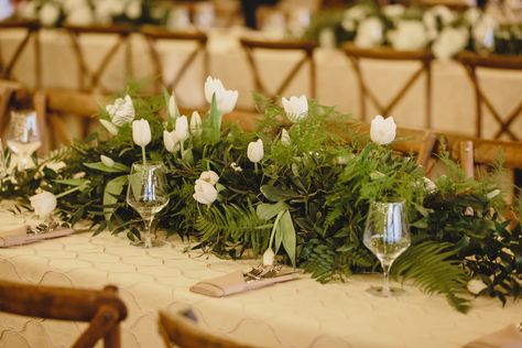 Green and white wedding flowers; landscape arrangement; white and green long and low arrangement; gold accents; white tulips; greenery arrangement; long table centerpieces; farm style tables; The Press Room; JoPhoto White Table Specialty Linen   Lisa Foster Floral Design   www.lisafosterdesign.com Long Table Floral Arrangements, Long And Low Flower Arrangement, Long And Low Arrangement, Green And White Wedding Flowers, White Wedding Table Decor, Long Table Centerpieces, White Flower Centerpieces, Olive Foliage, Farm Style Table