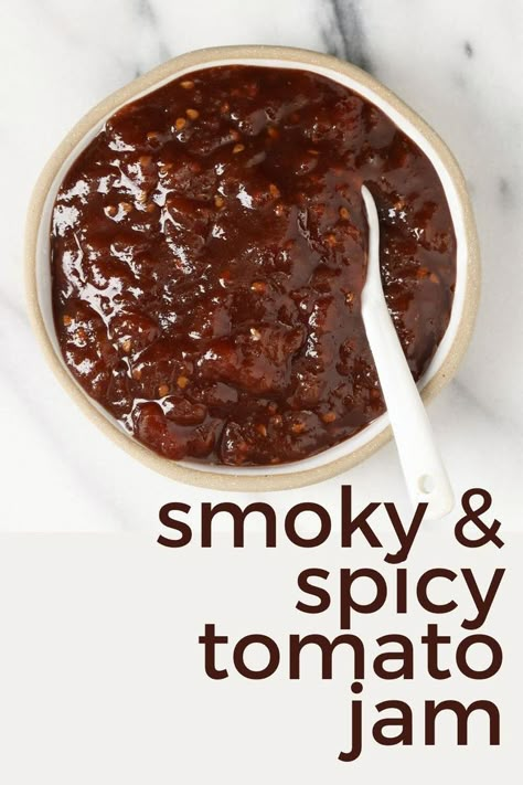 Smoky, Spicy, Tangy and just a little bit sweet, this Tomao Jam will be your favorite accompaniment to many things...your next cheese and cracker board, your next pizza, your next sandwich, and so many more. Recipe and instructions to water bath can. https://nourishandnestle.com/smoky-spiced-tomato-jam-recipe/ Tomato Chutney Canning Recipes, Spicy Tomato Jam Recipe Canning, Smoked Tomato Jam, Tomato Chilli Jam Recipe, Tomato Jalapeno Jam, Cowboy Tomato Jam, Tomato Relish Recipe Easy, Tomato Jam Recipes, Cherry Tomato Jam Recipe