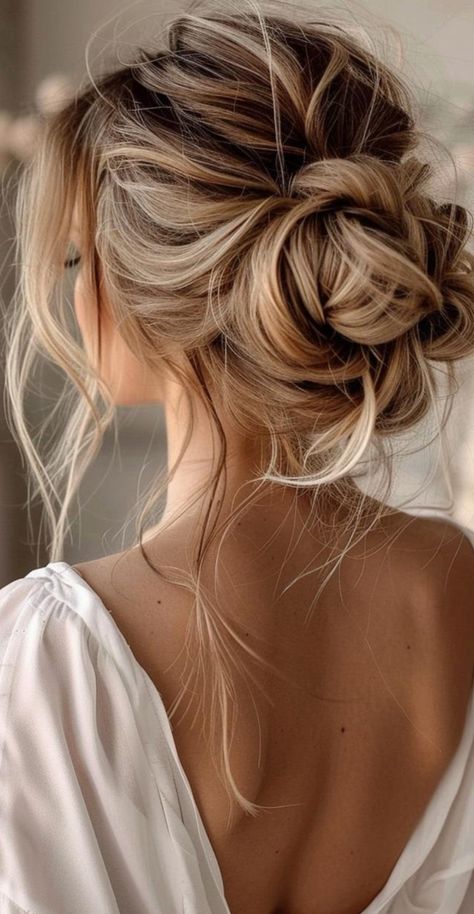 Transform your long locks with 27 stunning messy bun ideas that blend casual charm and elegance. These chic updos offer endless possibilities for both relaxed and formal settings. From textured high buns to relaxed low styles, find the ideal messy bun to showcase your long hair. Embrace these trendy, low-maintenance hairstyles that exude effortless beauty and sophistication. Wedding Messy Updos For Long Hair, Bridesmaid Low Messy Bun, Messy Formal Hair, Bridal Bun Messy, Up Dos Bridesmaids, Loose Up Do Wedding Hair, Messy Bun For Bride, Bride Messy Updo Hairstyles, Messy Low Updo