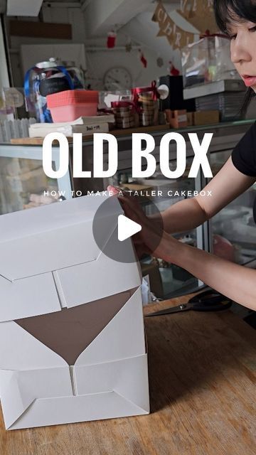 Charlotte Grace Cakeshop on Instagram: "Here's what my old packaging looks like. 😂 not sure if my ex part-timers got PTSD from crafting hundreds of boxes a week.
My dad came up with this concept box 13 years ago when I was baking from home. He had such a good laugh at me back then when I made many cakes but had no box to contain it. He couldn't take it anymore and crafted this out of 2 simple cakeboxes. I can't even count the number of times he will shake his head, laugh, and say '你这个人啊’ hahahahahaha 🤣  
.
.
.
#homebakerlasttime #smallbusiness #fatherknowsbest #cakedecorator #cakesg #cakebox #craft" How To Pack Cupcakes For Gift, Cake Box Design, Cake Boxes Packaging, Box Hacks, Valentine Table, Old Packaging, Father Knows Best, Valentine Table Decorations, Tall Cakes