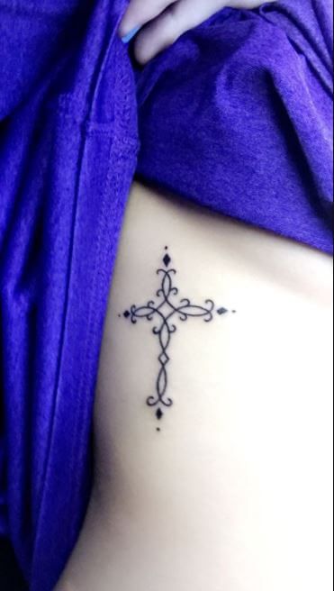 100 Celtic Cross Tattoo Designs Pictures with Meanings (2023) Cross Rib Tattoos, Small Rib Tattoos, Rib Tattoos For Women, Celtic Cross Tattoos, Cross Tattoos For Women, Cross Tattoos, Cross Tattoo Designs, Inspiration Tattoos, Rib Tattoo