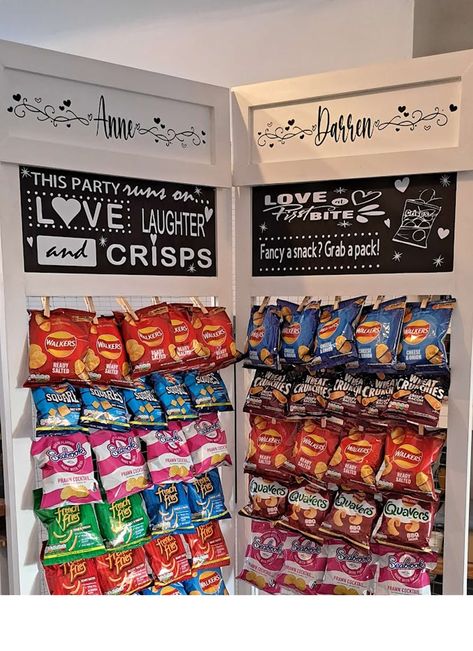 *Limited availability for March/April - order early to avoid disappointment* Personalised crisp/snack/sweet/treat walls for wedding celebrations, birthdays and anniversary parties, corporate events etc. (Or your own home!) Available as full height, floor standing walls or smaller tabletop models. Mini tabletop walls (hold up to 25 bags of crisps/sweets/chocs per panel) and are  available with 2-4 panels. Full height, floor standing walls (hold up to 50 bags per panel) are also available with 2-4 panels. The blackboards at the top of each panel are fully customisable and each board can contain either your own designs or I can design something for you. PLEASE NOTE - THE WHITE BAORDS AT THE TOP OF SOME OF THE WALLS IN THE IMAGES ARE DETACHABLE AND COST AN EXTRA £20 EACH As standard the frames Crisp Stand Wedding, Wedding Crisp Wall Ideas, Snack Bar At Wedding Receptions, Crisp Wall Party, Chip Wall For Party, Snack Bar Wedding Receptions, Crisps At Wedding, Snack Wall Party, Wedding Snack