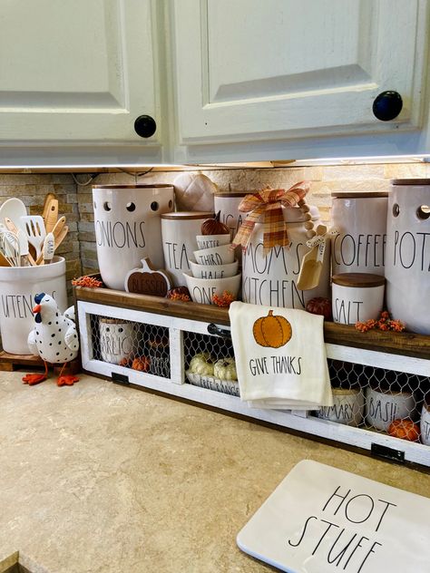 Rae Dunn Decorating Ideas, Rae Dunn Kitchen, Rae Dunn Coffee Bar, Fall Rae Dunn Display, Rae Dunn Fall Decor, Rae Dunn Gingerbread Display, Rae Dunn Canister Display Shelf, Chicken Wire Basket, Rae Dunn Halloween