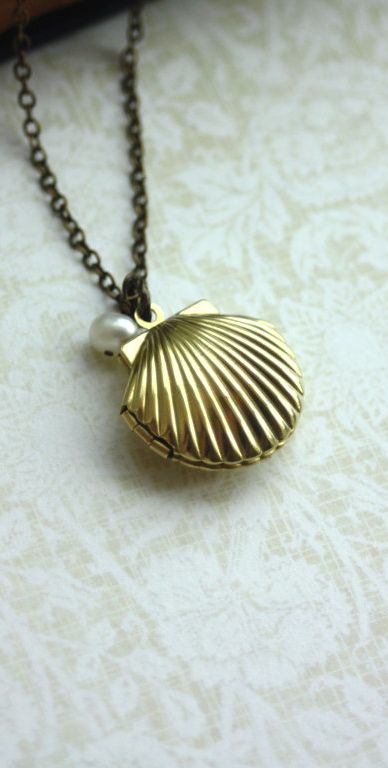 Beach Wedding. Melody's Locket. Little Mermaid Locket. Shell Locket, Freshwater Pearl Necklace | By Marolsha. Seashell Locket, Mermaid Locket, Shell Locket, Mermaid Shell, Gold Locket, Disney Jewelry, Shell Necklace, Shell Jewelry, Freshwater Pearl Necklaces