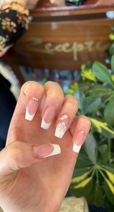 Nail Design For Ring Finger, Coffin French Tip With Flowers, Classic French Tip Nails With Design, Short Coffin Flower Nails, White French Tip Nails With Flower On Ring Finger, White French Tip Nails With Design On Ring Finger, Prom Nails With Flowers, Accent Nail Ideas Ring Finger Simple, Hawaiian Flower Nails French Tip