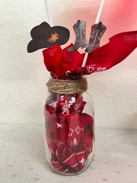 Mason jar, bandana, cupcake toppers, twine and balloons with sticks. Bandana Centerpiece Ideas, First Rodeo Table Centerpiece, Diy Western Centerpieces, Cowboy Hat Centerpiece Ideas, Rodeo Centerpieces, Western Theme Party Decorating Ideas, Cowboy Centerpieces, Western Centerpieces, Black Rodeo