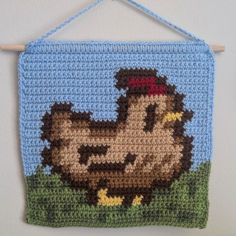 Just realized I never showed you guys this Stardew Valley chicken tapestry I made a while ago! Pattern by @jfoocreates 🩷 I have over 250 hours in Stardew Valley at this point lol. I recently started playing with mods for the first time! I'm playing Stardew Valley Expanded 🩷 #stardewvalleyfanart #stardewvalley #stardewvalleycrochet #crochettapestry #crochetwallhanging #crochetchicken #cubiecrochet Chicken Alpha Pattern, Crochet Stardew Valley Pattern, Stardew Valley Chicken Crochet, Crochet Stardew Valley, Stardew Valley Crochet Pattern, Stardew Valley Alpha Pattern, Stardew Valley Crochet, Diy Gifts To Make, Stardew Valley Fanart