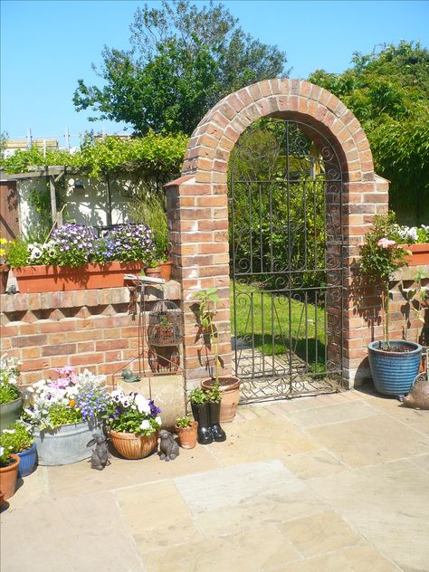 Brick arch metal garden gate in our garden Brick Archway Exterior, Bricked Archway, Garden Archway Ideas, Garden With Bricks, Brick Gate, Brick Garden Wall, Archway Ideas, Brick Arches, Brick Wall Gardens