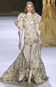 (1/26/16) On runways today you can begin to see the leg-of-mutton sleeves coming back on a new style of dress, this is a contemporary take on the bustle period look of the 1890s-1900s. Drag Clothing, Olivier Theyskens, Mutton Sleeve, Vlada Roslyakova, T Photo, 1900s Fashion, Yellow Gown, Leg Of Mutton Sleeve, Big Sleeves