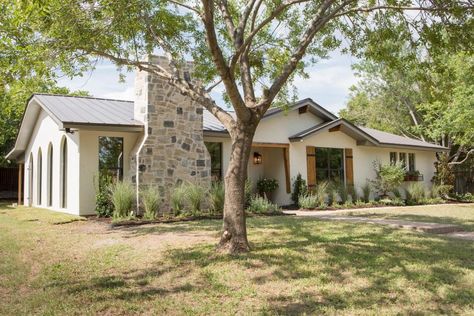 Ranch House to Modern Mediterranean Retreat | Fixer Upper | HGTV Long Ranch House Exterior, Neutral Home Exterior, Modern Mediterranean Home, Ranch House Exterior, Exterior Fireplace, Hgtv Fixer Upper, Concrete Walkway, House Shutters, Stone Chimney