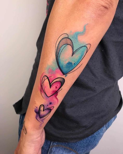 Watercolor Heart Tattoos 3 Watercolor Heart Tattoos, Heart Tattoo Ideas, Watercolor Butterfly Tattoo, Small Watercolor Tattoo, Colour Tattoo For Women, Watercolor Rose Tattoos, Colorful Tattoo, Heart Watercolor, Heart Tattoo Designs