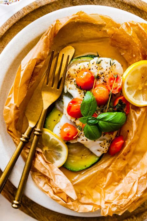 Baked Cod in Parchment Fish In Parchment Paper, Feta Potatoes, Fish In Parchment, Cod Baked, Mediterranean Cod, Papillote Recipes, Breathe Underwater, Large Zucchini, Grilled Cheese Croutons