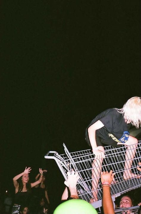 black background, crowd underneath a girl riding a shopping cart Moshpit Photography, Punk Party Aesthetic, 90s After Party, Punk Playlist Covers, Punk Photos, Moshpit Aesthetic, Punk Asethic, 2000s Concert, Mosh Pit Outfit