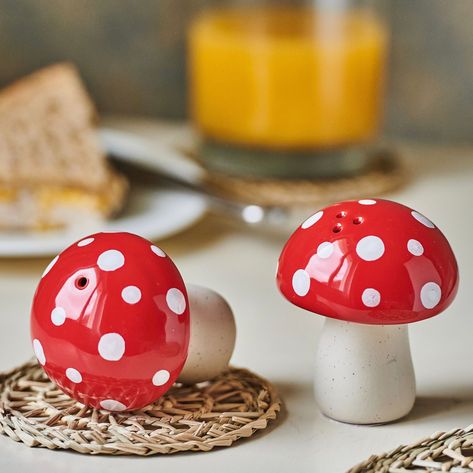 These hand painted mushroom salt & pepper shakers will give every dining table an original touch.     Crafted from ceramic to create our mushroom design.     Featuring a colourway of soft white, cream and red.     A wonderful and affordable gift or a great addition to your collection of kitchen accessories. Dimensions W 6.00 x L 6.00 x H 7.50 cm Made from Ceramic Mushroom Salt And Pepper Shakers, Mushroom Kitchen Decor Ideas, Mushroom Kitchen Theme, Mushroom Ceramics Ideas, Red Mushroom Art, Engineering Inspiration, Mushroom Kitchen Decor, Mushroom Things, Cute Salt And Pepper Shakers