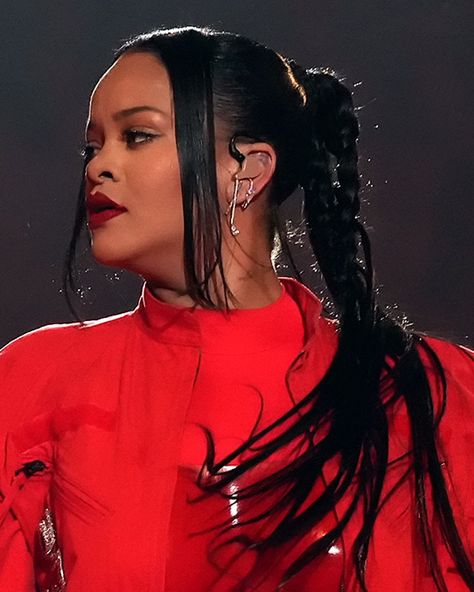 Rihanna Ear Piercings, Rihanna Superbowl 2023, Rihanna Red Lipstick, Blonde Perm, Rihanna Ponytail, Rihanna Superbowl, Plaited Ponytail, Curly Top Knot, Rihanna Work