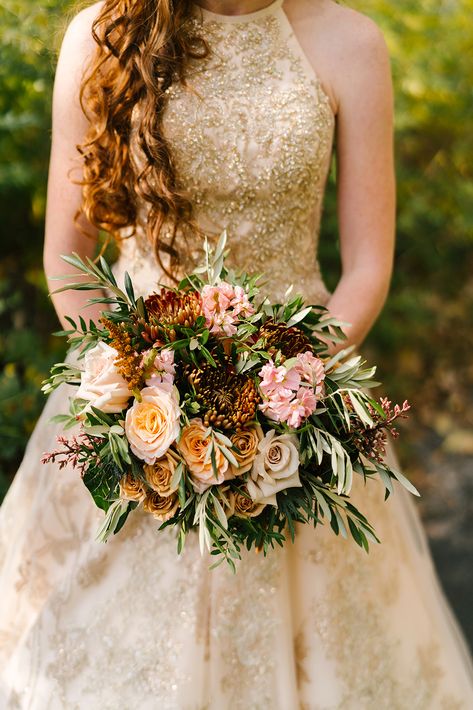 LOVE a bridal gown with gold accents. Beautifully paired with muted fall tones and photographed by Megan Antelek. #wedding #weddingbouquet #bride #bridalbouquet #goldaccents #goldweddinggown #fallwedding #fallflowers Flowers With Gold Dress, Golden Wedding Bouquet, Gold Wedding Flowers, Gold Wedding Gowns, Golden Gown, Natural Bouquet, Gold Bouquet, Copper Dress, Bronze Dress