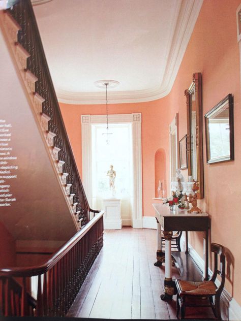 Peach walls and elegant staircase Peach Walls, American House, Entry Hall, Entry Way, Living Room Paint, Room Paint, Room Colors, Colorful Interiors, House Colors