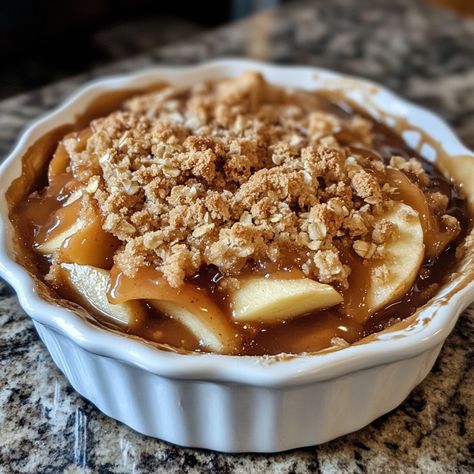 🍏🍎 Caramel Apple Crumble—Sweet, buttery, and packed with apple goodness! This Caramel Apple Crumble is your perfect fall dessert. 🍂🍮 #AppleCrumble #FallDessert Caramel Apple Crumble Ingredients: Apples (4 cups, peeled and sliced) Granulated sugar (1/2 cup) Brown sugar (1/4 cup) All-purpose flour (1/2 cup) Oats (1/2 cup) Butter (1/4 cup, cold and cubed) Caramel sauce (1/2 cup) Cinnamon (1 tsp) Nutmeg (1/4 tsp) Instructions: Preheat oven to 350°F (175°C). Grease a baking dish. Mix apples wi... Apple Crumble Caramel, Apple Crumble Dessert, Apple Snickerdoodle, Caramel Apple Crumble, Instagram Recipes, Trending Recipes, Fall Dessert, Apple Crumble, Caramel Apple