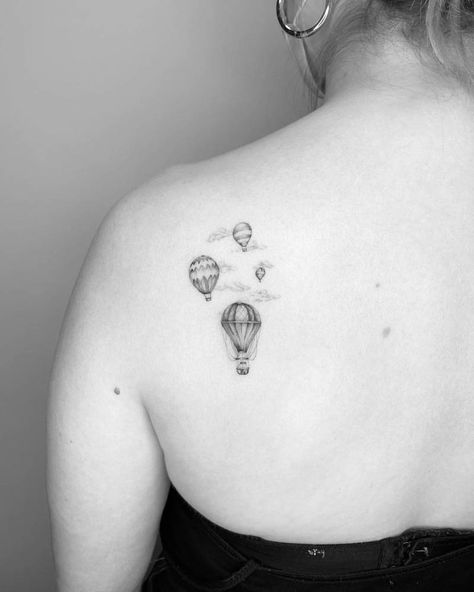 Single needle hot air balloons tattooed on the shoulder Mini Hot Air Balloon Tattoo, Vintage Hot Air Balloon Tattoo, Tiny Hot Air Balloon Tattoo, Airbaloon Tattoo, Hot Air Balloon Tattoos, Small Hot Air Balloon Tattoo, Balloons Tattoo, Night Sky Tattoos, Adorable Tattoos