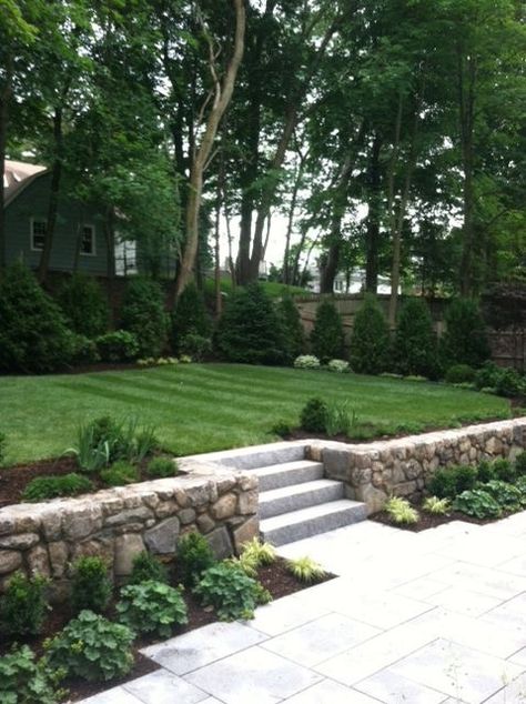 Backyard Low Retaining Wall, Boxwood On Slope, Terraced Landscaping Retaining Wall, Backyard Landscaping With Retaining Wall, Backyard Patio With Retaining Wall, Leveling Front Yard Retaining Walls, Backyards With Retaining Walls, Front Yard Retaining Wall With Steps, Patio With Retaining Wall And Steps