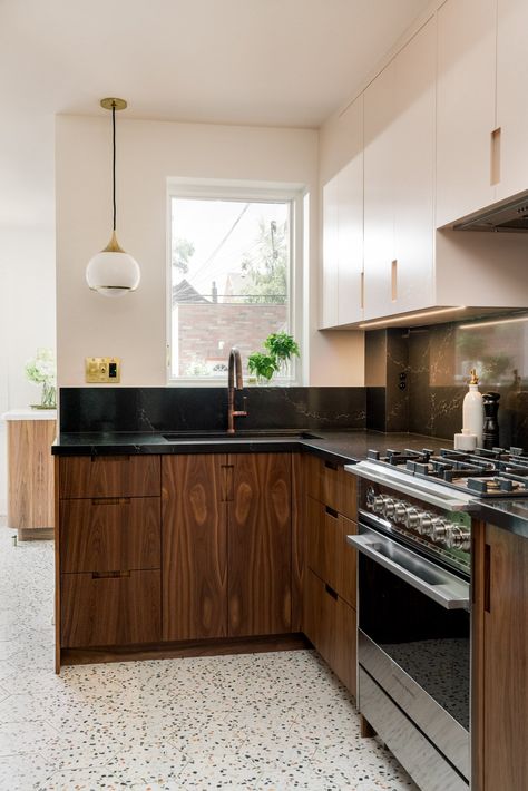 A narrow galley kitchen with blush pink upper cabinet and ceiling, black countertops, and brown lower cabinets. The floor is filled with a hexagonal terrazzo tile. Narrow Galley Kitchen, Kitchen Terrazzo, Colour Drenching, No Upper Cabinets, Charming Dining Room, Vaulted Ceiling Kitchen, Black Appliances Kitchen, Lower Cabinets, Galley Kitchen Design