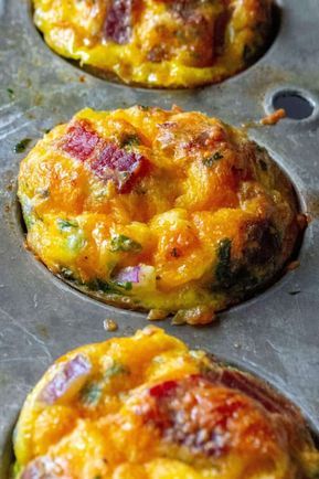 Keto Bacon Egg Muffins are low in carbs and high in protein and packed with tons of bacon, cheese and sausage.  The perfect muffin tin eggs, these Keto Bacon Egg Muffins are fun to make, super tasty and the best easy low-carb keto breakfast on the go. | A Wicked Whisk #breakfastmuffins #breakfasteggmuffins #eggmuffincups #healthyeggmuffins #lowcarbeggmuffins #ketobreakfast #ketoeggmuffins #lowcarbbreakfast #lowcarbeggcups #ketoeggmuffinsbacon #ketoeggmuffinssausage Keto Breakfast On The Go, Muffin Tin Eggs, Low Carb Egg Muffins, Bacon Egg Muffins, Breakfast Egg Muffins, Keto Muffins, Keto Bacon, Egg Muffins Breakfast, Food Keto