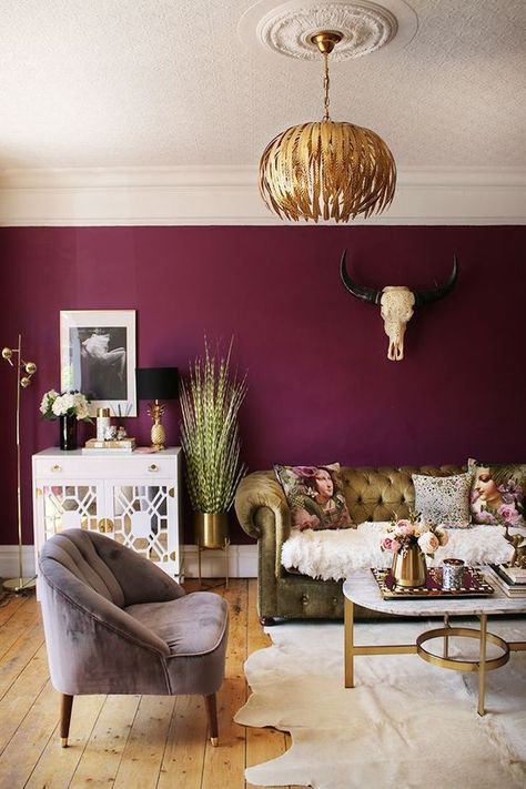 A gorgeous and luxurious interior than uses a moody deep raspberry jewel tone paint colour on the walls but keeping the rest of the interior light and playful. #moodylivingroomjeweltones #moodyinteriordesignlivingrooms #moodylivingrooms #moodyinteriorinspiration Plum Living Rooms, Living Room With Gold Accents, Olive Green Velvet Sofa, Room With Gold Accents, Plum Living Room, Plum Living, Purple Living Room, Olive Green Velvet, Furnitur Ruang Keluarga