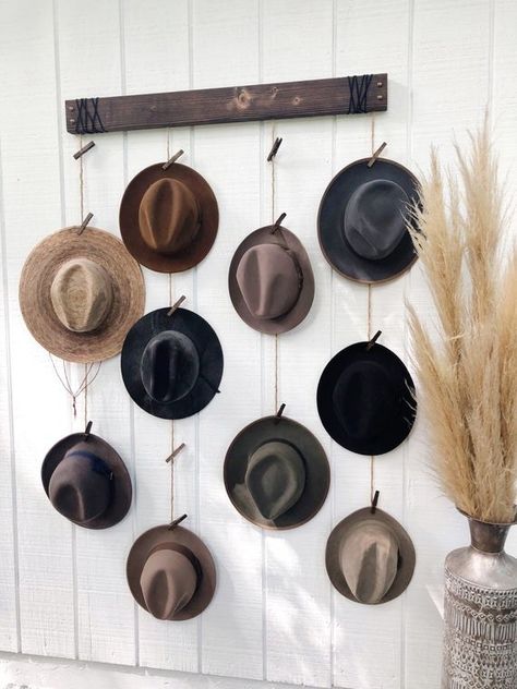 A hat organizer that essentially turns your beautiful hat collection into an equally beautiful work of art. Yes, this would only work if you have a big closet or an empty wall in your bedroom, but you're lucky enough to have the room, we say go for it! Wall Hat Racks, Hat Organizer, Wall Hats, Hanging Hats, Upholstery Tacks, Hat Hanger, Hat Organization, Hat Display, Boutique Decor