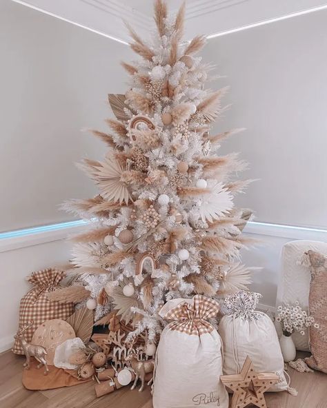 You Have to See These Flower Christmas Trees! White Christmas Tree With Pampas, Boho Cristhmas Tree, White Pampas Christmas Tree, Boho Theme Christmas Tree, Christmas Tree Pampas Decor, Boho Pink Christmas Tree, Boho Themed Christmas Tree, Christmas Tree With Pampas Decor, Boho Christmas Tree Decorations