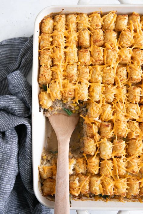 The very BEST Tater Tot Casserole Recipe! Creamy, comforting, and packed with yummy ground meat, green beans, corn, cheese, and crispy tater tots! Learn how to make this family favorite two ways - with and without soup! Tater Tot Casserole Without Cream Soup, Best Tater Tot Casserole, Tater Tot Hotdish, Tater Tot Casserole Recipe, Tater Tot Casserole Recipes, Recipe Hacks, Canned Soup, Corn Cheese, Homemade Sauce Recipes