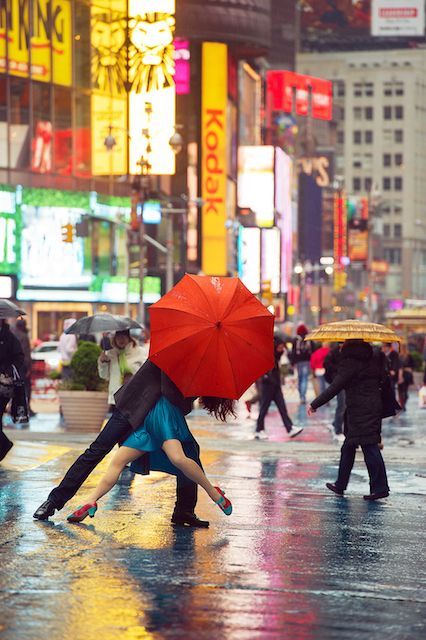 If Only Your Commute Looked Like THIS #refinery29  http://www.refinery29.com/dancers-among-us-new-york-photographs#slide-17  "Michael Jagger and Evita Arce are an international swing dancing sensation. They created this pose as a finale to one of their dances. When I saw it on their website, I imagined them in the rain in Times Square. To my great fortune, it was a dreary spring day when we met." Dancers Among Us, Under An Umbrella, Umbrella Photo, Rain Dance, Nyc Times Square, Dance Like No One Is Watching, Swing Dancing, Red Umbrella, Shall We Dance