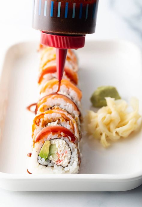 Sushi roll on a white rectangle plate. A squirt bottle is drizzling eel sauce made with 3 ingredients across the top of the roll. Eel Sauce Recipe, Sauce For Sushi, Raw Fish Recipes, Eel Sushi, Hibachi Fried Rice, Eel Sauce, Rectangle Plate, Japanese Sauce, Easy Stir Fry