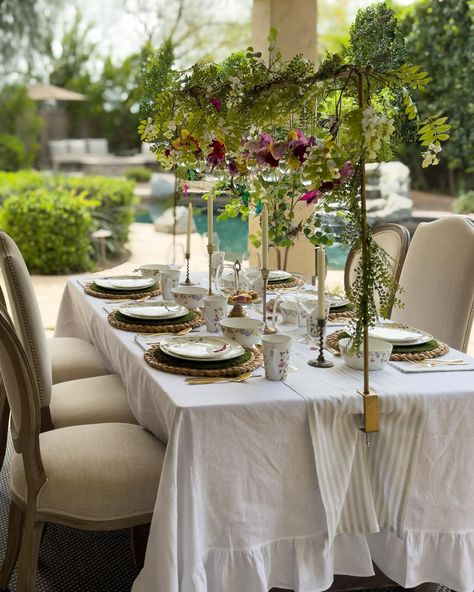 Some snapshots of my Garden Tea Party table, complete with floral dishes, a ruffled white tablecloth, and my favorite table rod adorned with hanging jars of fresh flowers and dancing butterflies 🦋🌸🍃 �🦋Comment LINK for a link of items on this table to be sent to your inbox. Or visit the link in my bio. #tablescape #springtablescape #alfrescodining #mikasalifestyle #teaparty #ltkhome Over Table Rod, Over The Table Rod, Hanging Jars, Tea Party Table, Family Party Games, Spring Tablescapes, Tea Party Garden, Fall Dinner, White Table Cloth