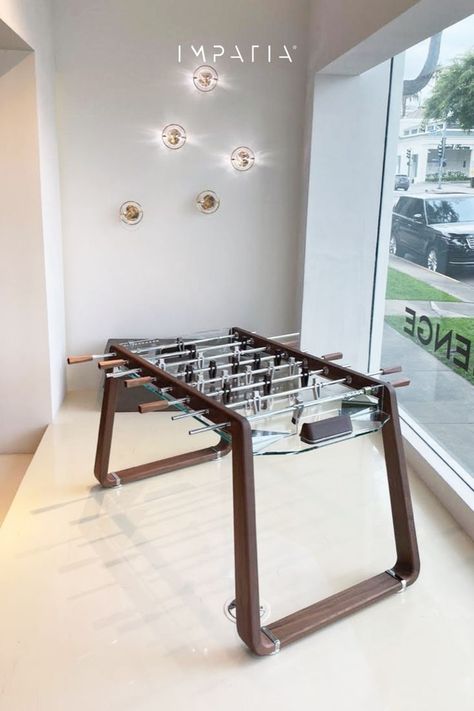 A modern custom designed foosball table made from walnut with a transparent glass playing field. Dutch Colonial Interior, Aesthetic Arcade, Modern Game Room, Snooker Room, Foosball Tables, Colonial Interior, Foosball Table, Metal Furniture Design, Foosball