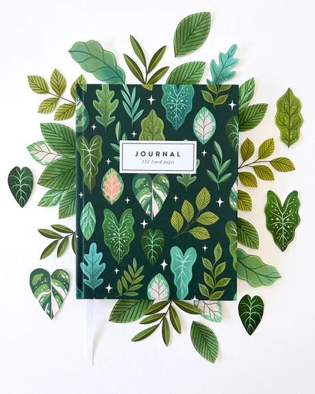 Our "Tropical Leaves" Pattern covers our new Hardcover Notebooks with a deep jungle vibe. This Journal feels cozy and wild at the same time, with plenty of pages to explore your thoughts and dreams. Illustrated leaves of all variety wrap around the entire journal, including the spine, making this journal a gorgeous gif Deep Jungle, Notebook Cover Design, Tropical Leaves Pattern, Dot Grid Journal, Place Holder, Stationery Inspiration, Ruled Paper, Cute Notebooks, Girly Gifts